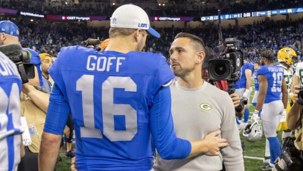 Detroit Lions quarterback Jared Goff shakes hands with Green Bay Packers coach Matt LaFleur.